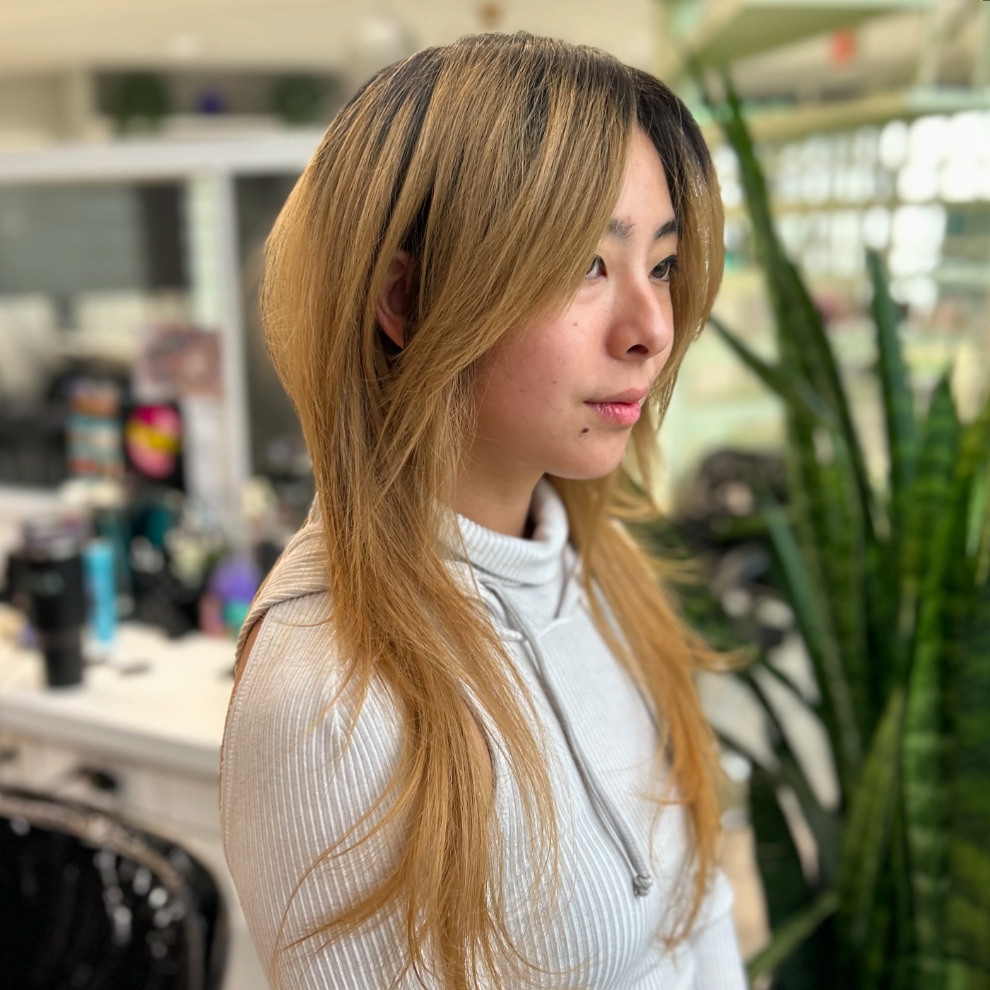 Modern Asymmetrical Hush Cut with Subtle Highlights