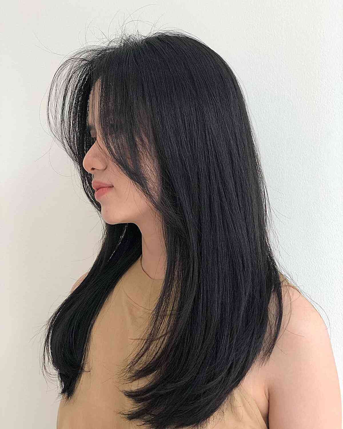 Sleek Long Layered Cut with Face-Framing Layers