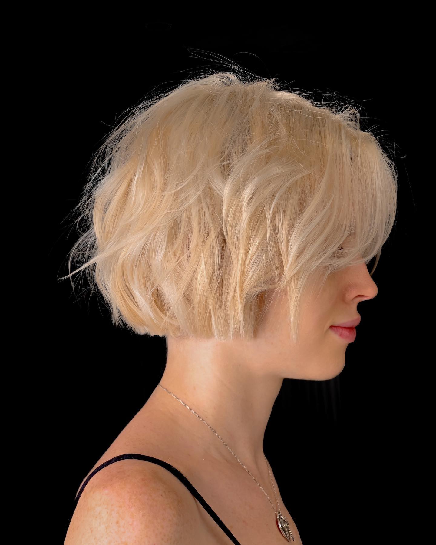 Softly Textured Ash Blonde Bob with Natural Waves