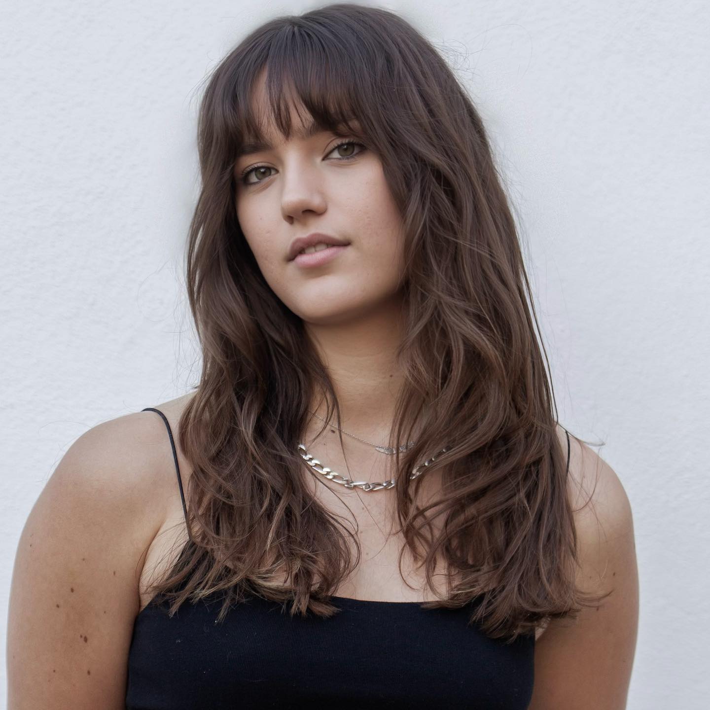Textured Long Layers with Trendy Fringed Bangs