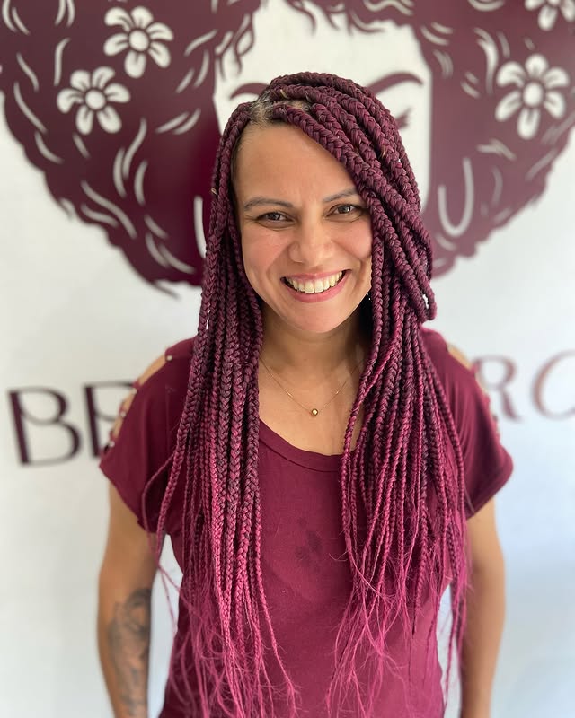 Vibrant Burgundy Box Braids with Playful Volume