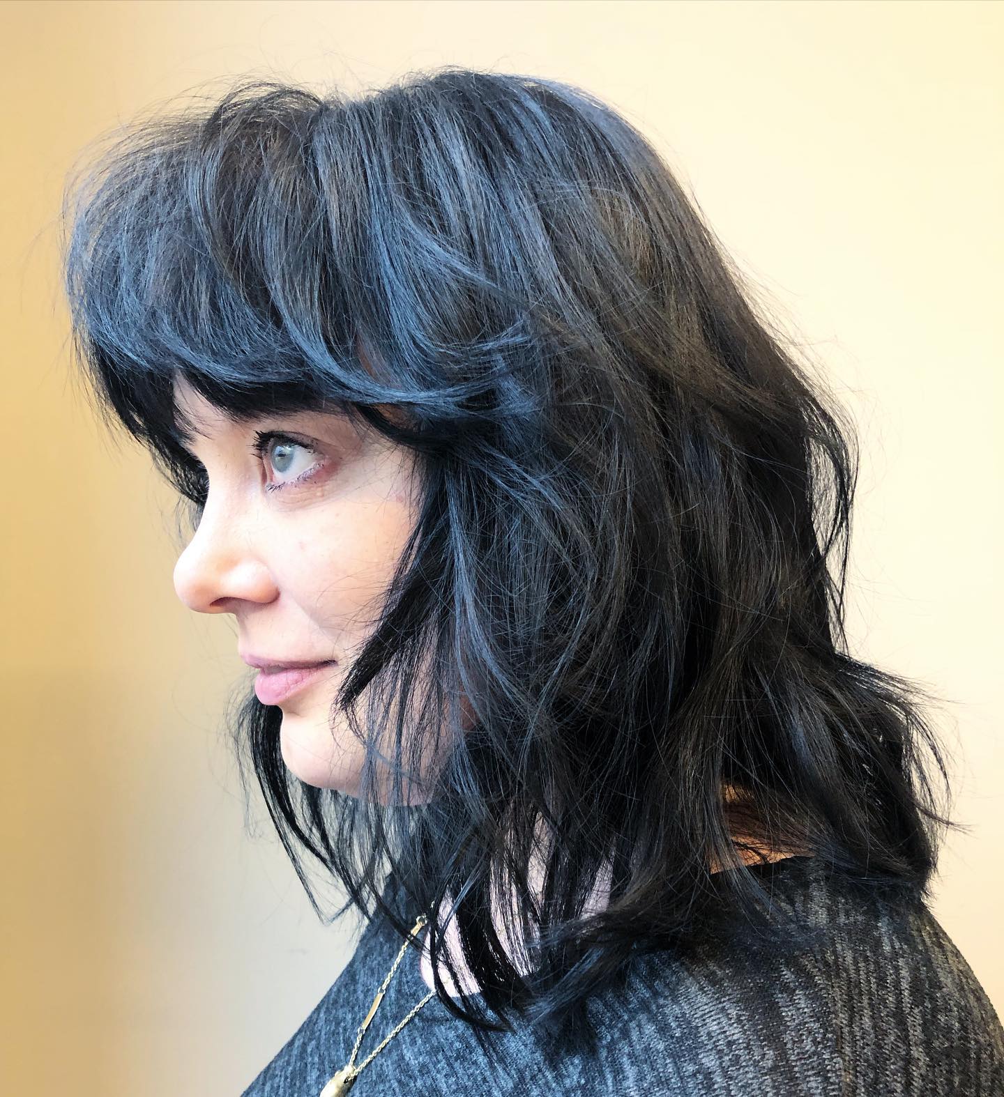 Modern Wavy Cut with Playful Choppy Bangs