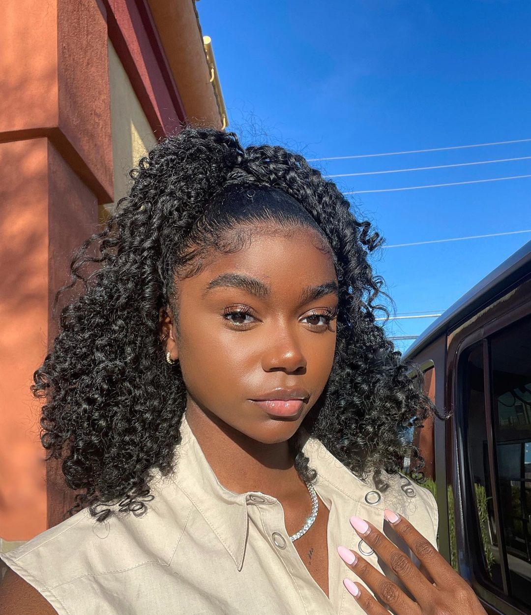 Chic Curly Half-Up Style with Defined Curls