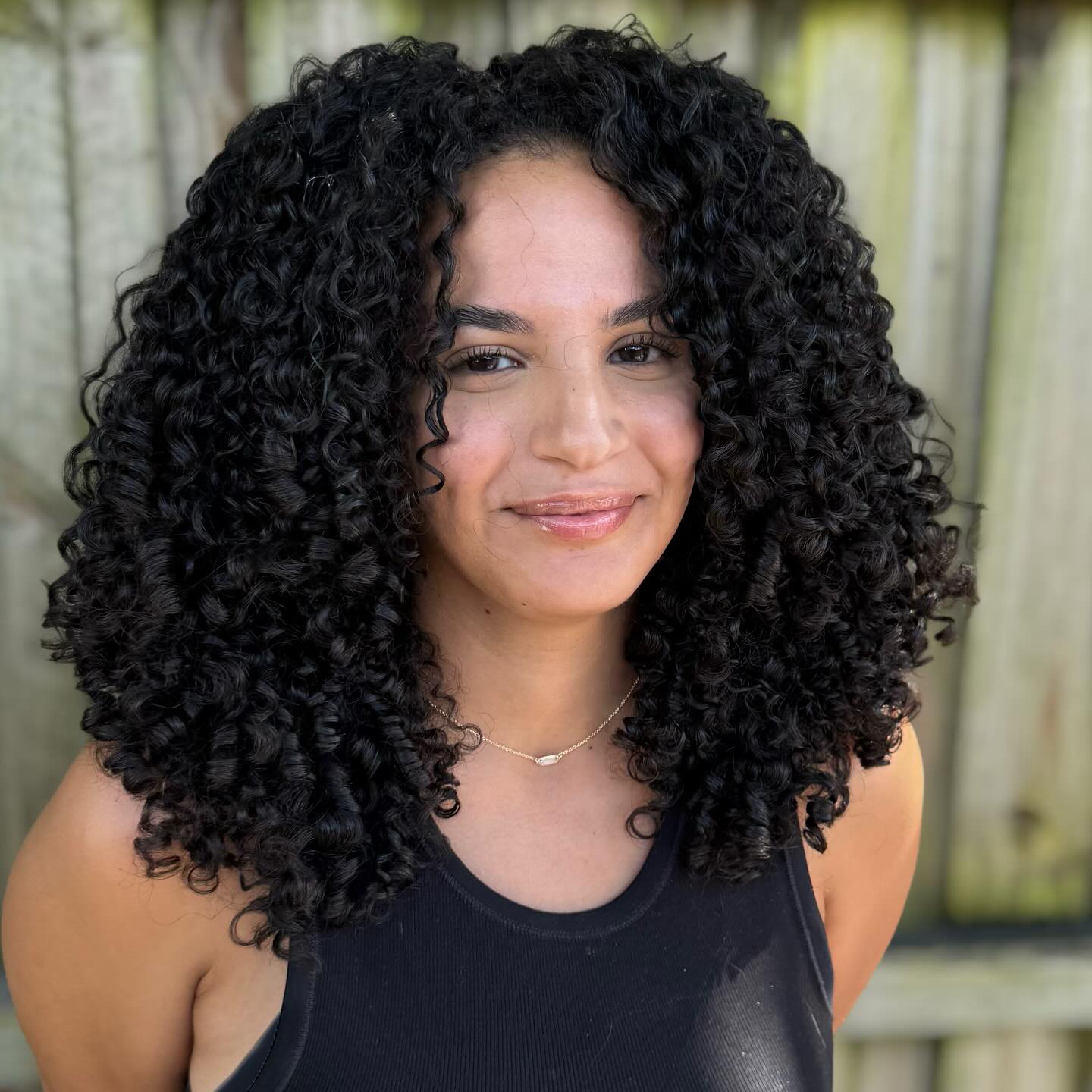 Full-Volume Curly Shoulder-Length Cut with Defined Curls