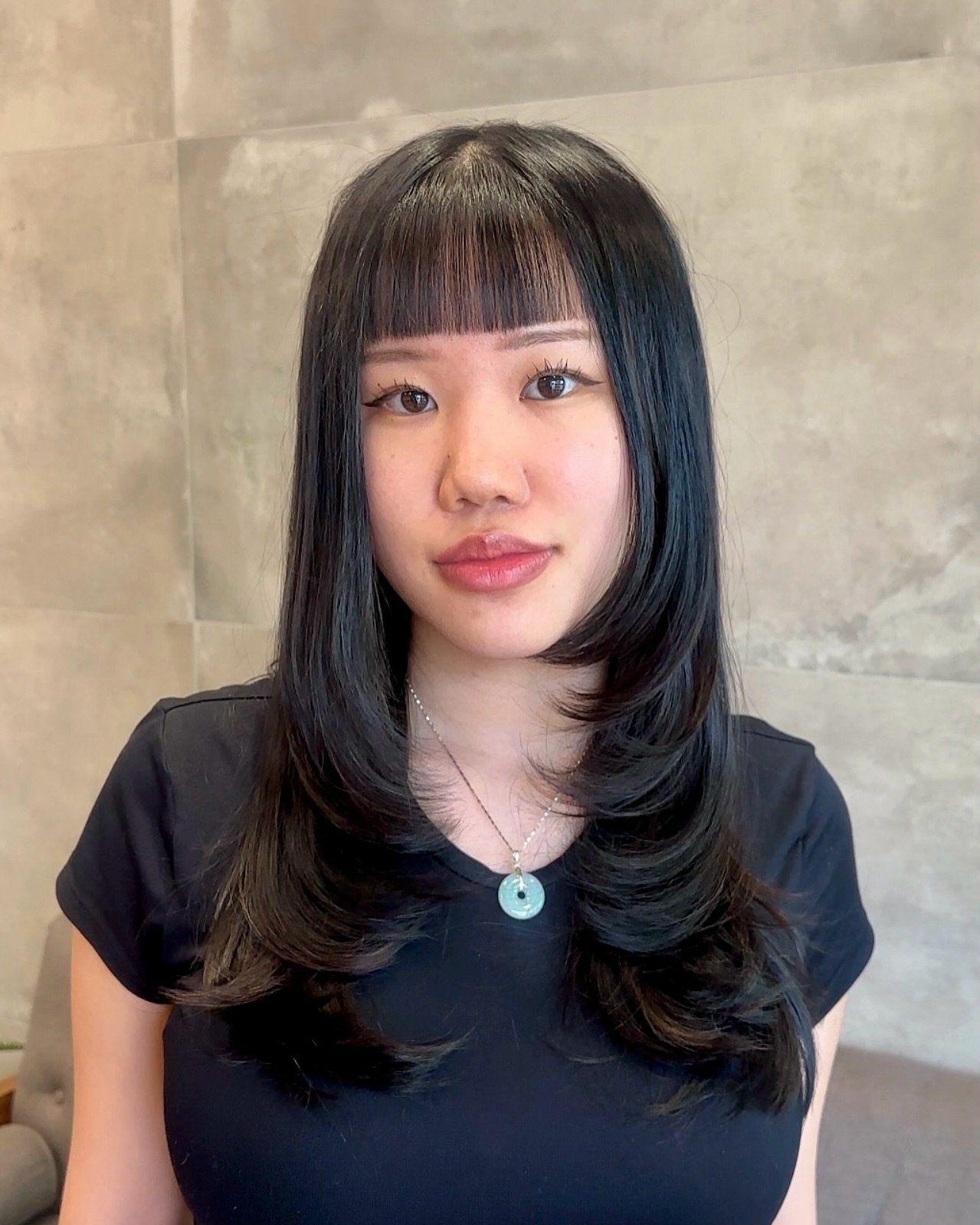 Sleek Long Layers with Flattering Face-Framing Bangs