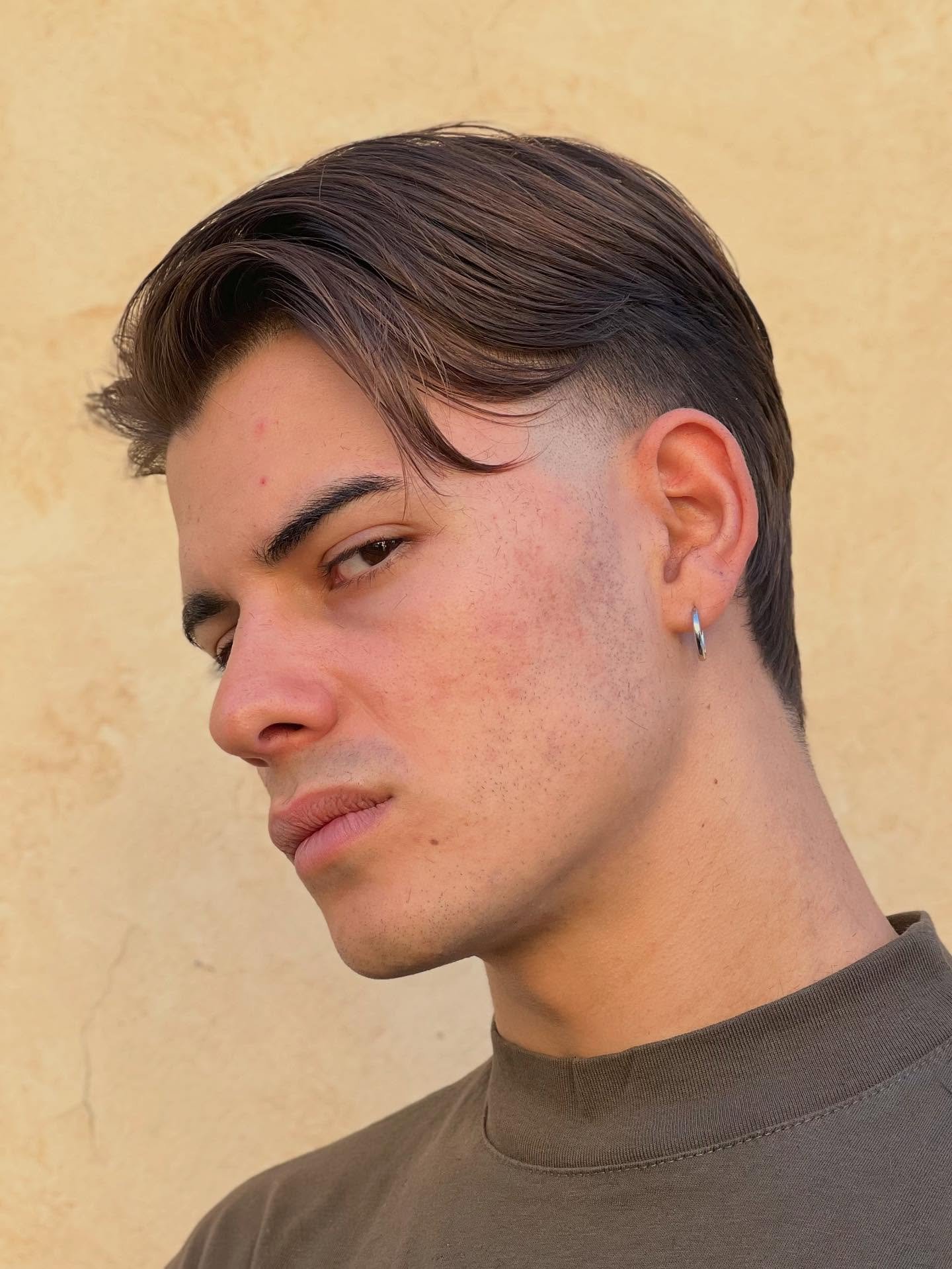 Sleek Textured Side Part with Tapered Undercut