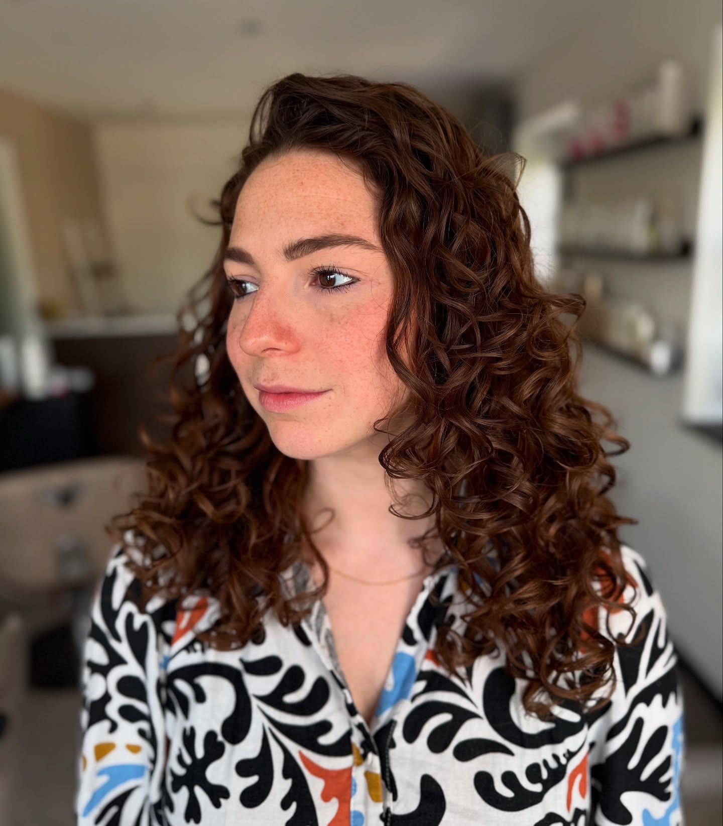 Soft Curly Mid-Length Cut with Defined Layers