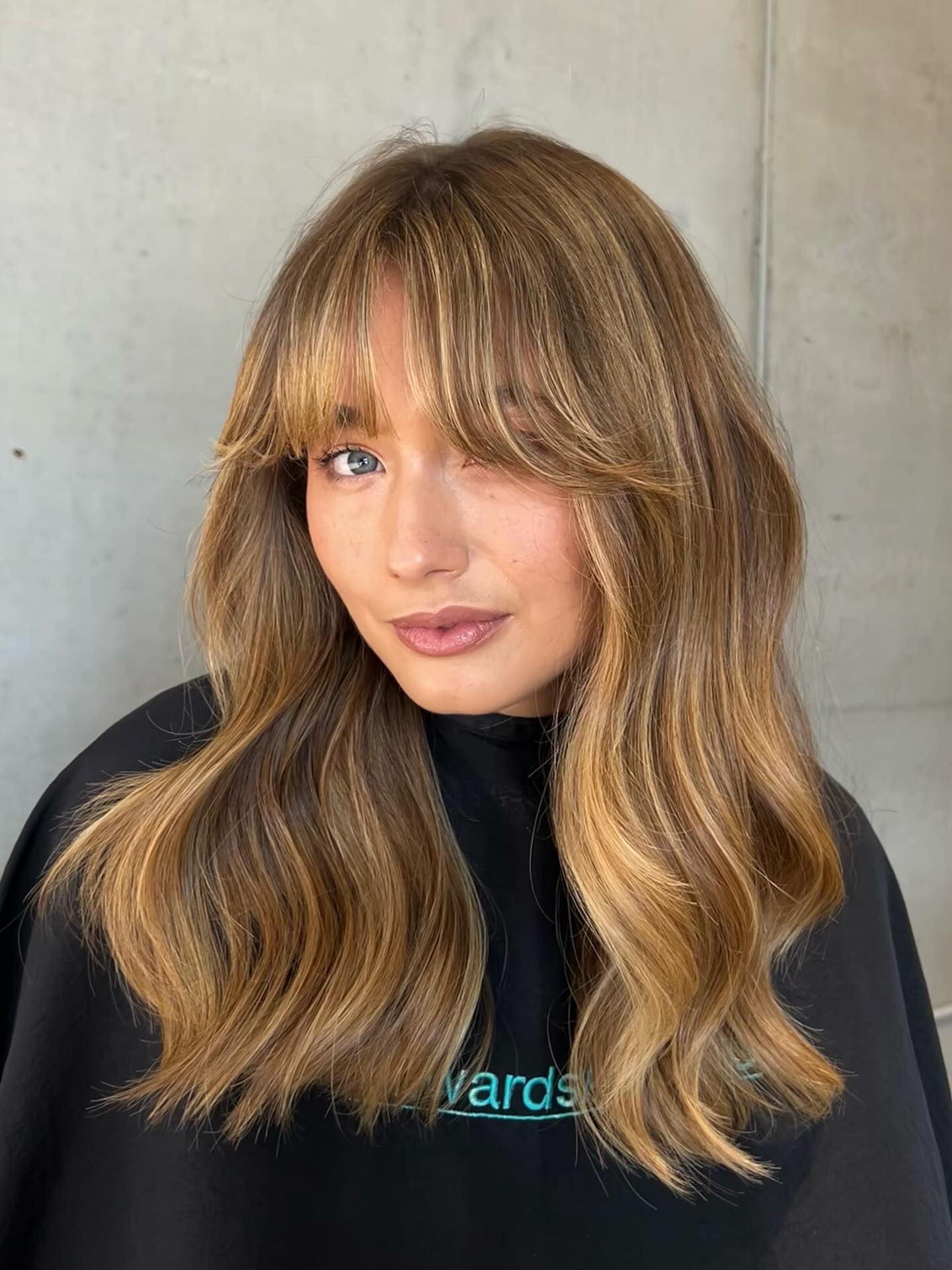 Soft Layered Waves with Face-Framing Bangs