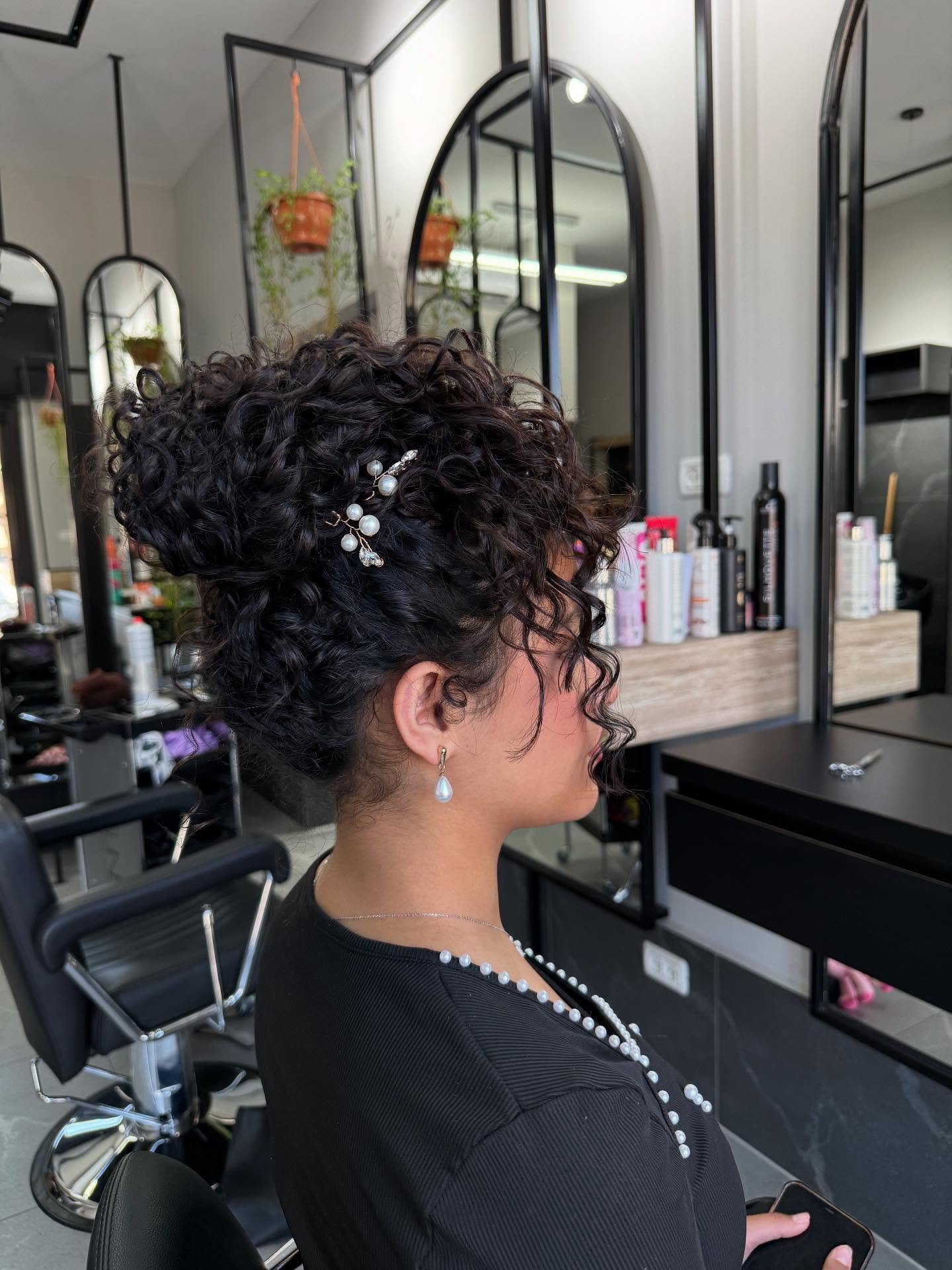 Textured Curly Updo with Decorative Hairpin