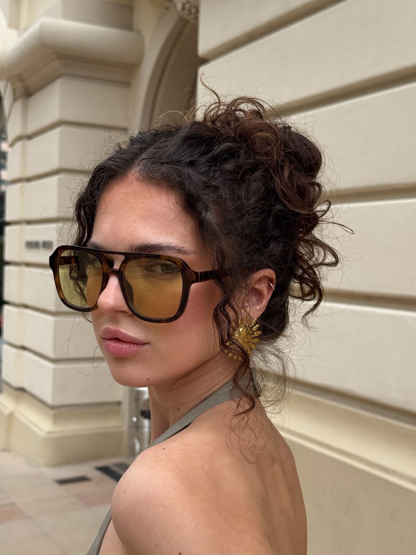 Textured Curly Updo with Playful Volume
