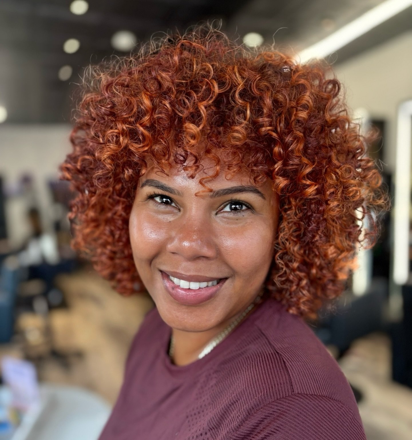 Vibrant Curly Copper Bob with Defined Texture
