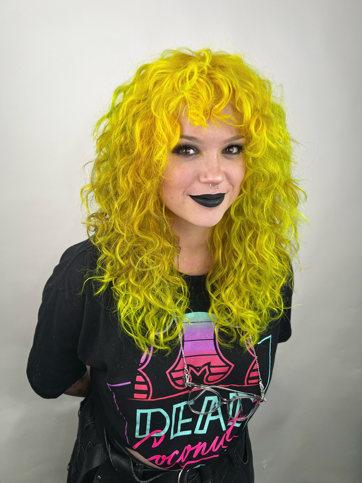 Vibrant Curly Cut with Bold Neon Yellow Tones
