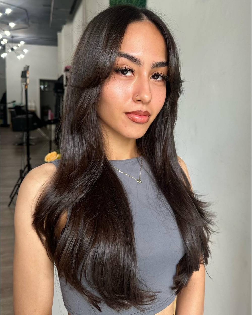 Sleek Long Layers with Soft Face-Framing Bangs