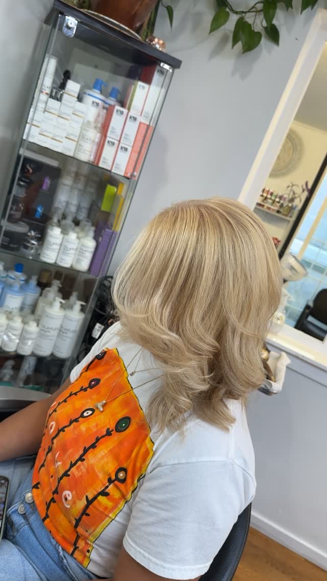 Light Blonde Layered Cut with Soft Textured Waves