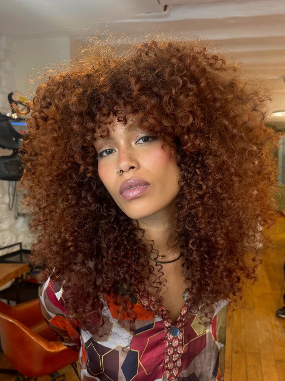 Lush Copper Spiral Curls with Voluminous Layers