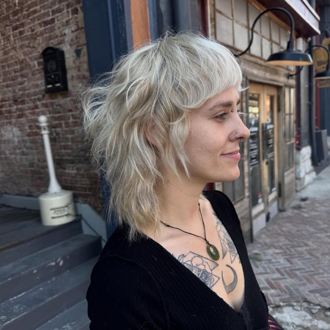 Effortlessly Tousled Platinum Mullet with Soft Fringe