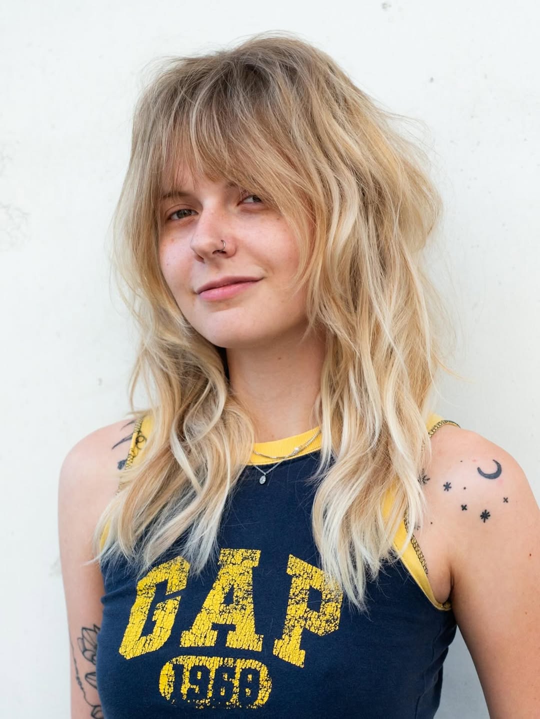 Shaggy Blonde Layers with Curtain Bangs