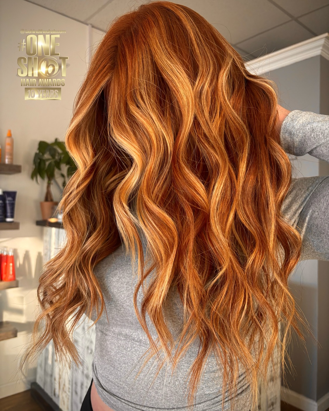 Bold Flame-Hued Curls with Creamy Blonde Highlights