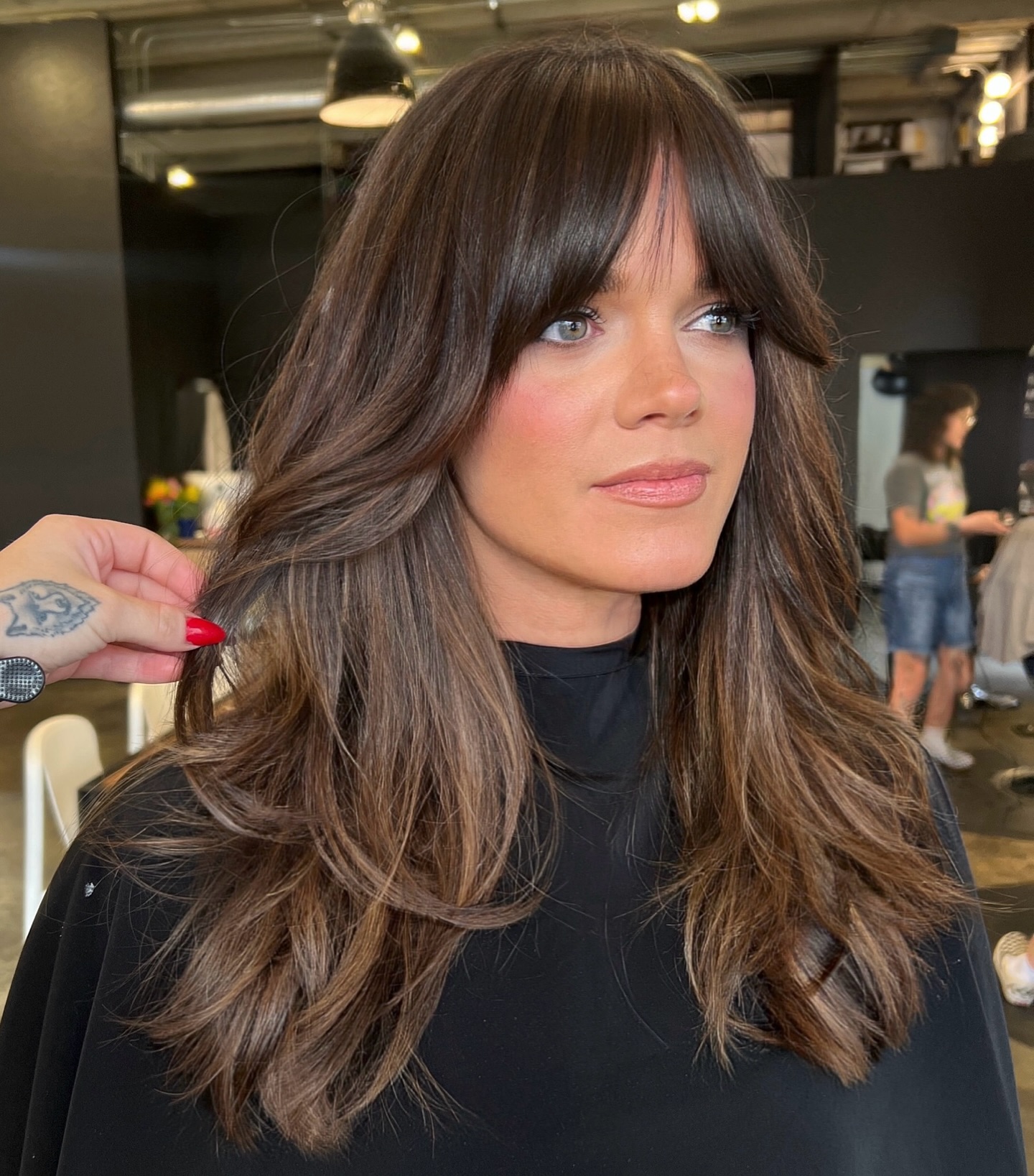 Sumptuous Chestnut Waves with Wispy Bangs