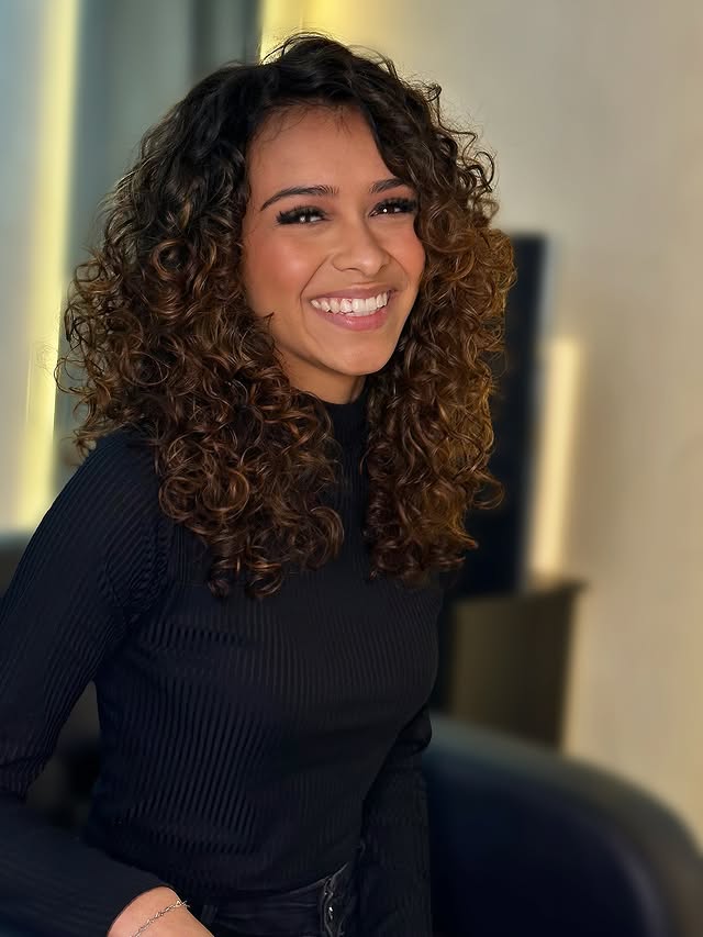 Lively Caramel Curls with Strategic Layering