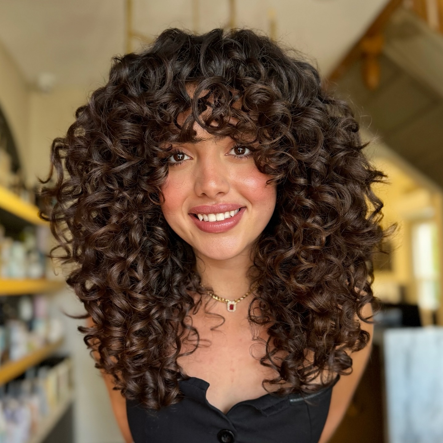 Voluminous Chestnut Ringlets with Face-Framing Layers