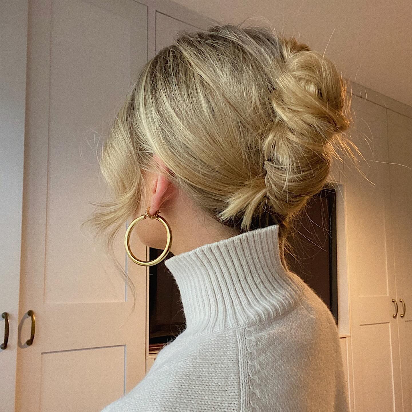 Elegant Twisted Low Bun with Soft Face-Framing Strands