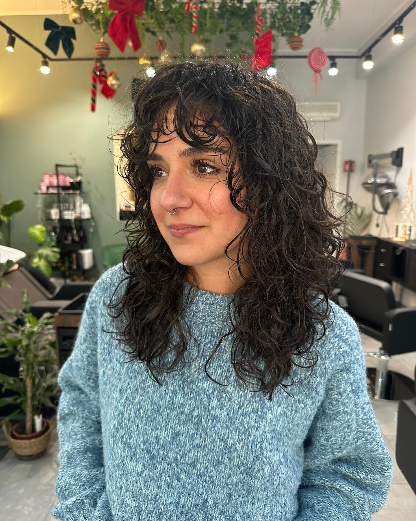 Playful Curly Wolf Cut with Soft Fringe