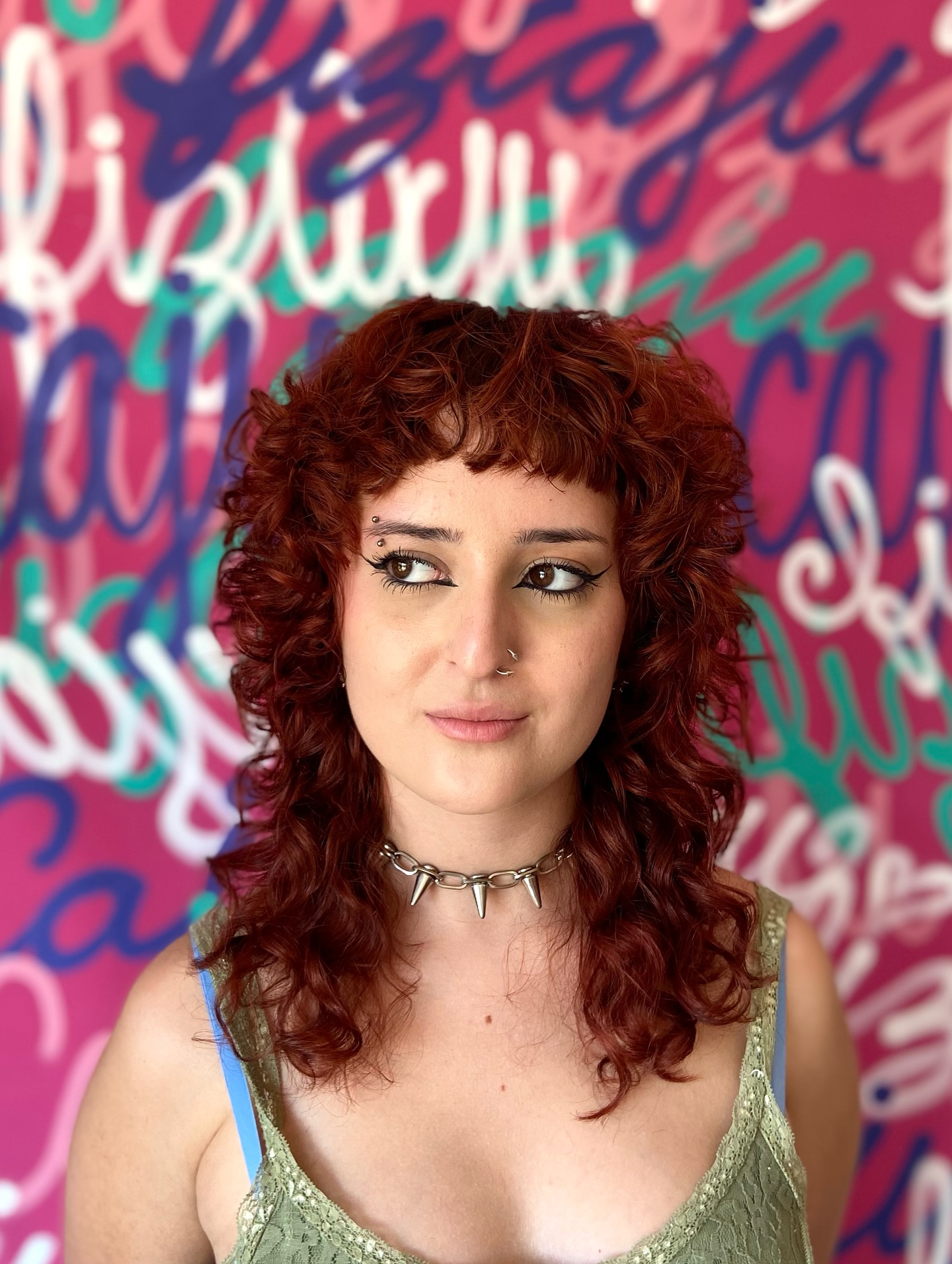 Textured Curly Wolf Cut with Playful Bangs