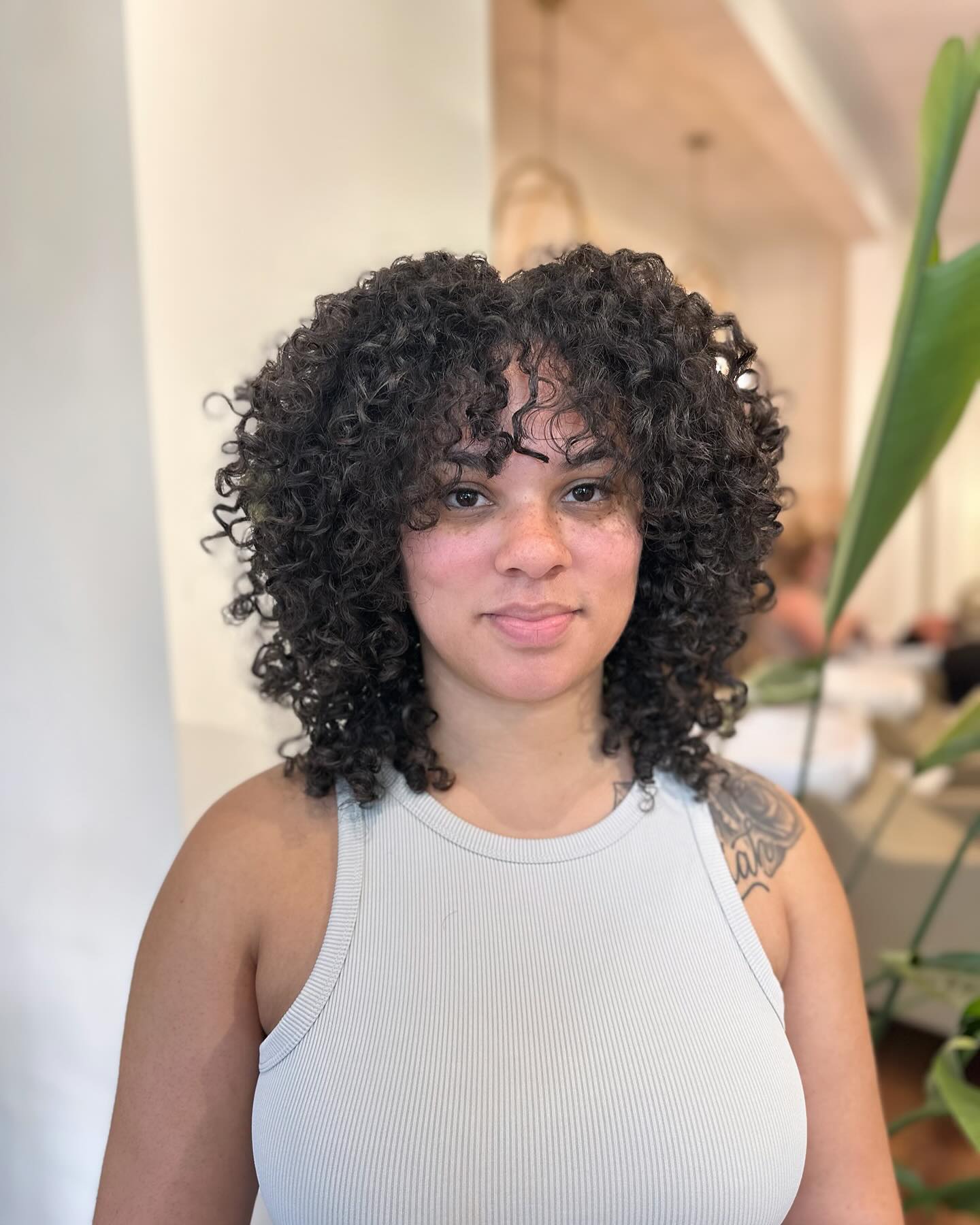 Defined Curly Bob with Face-Framing Layers