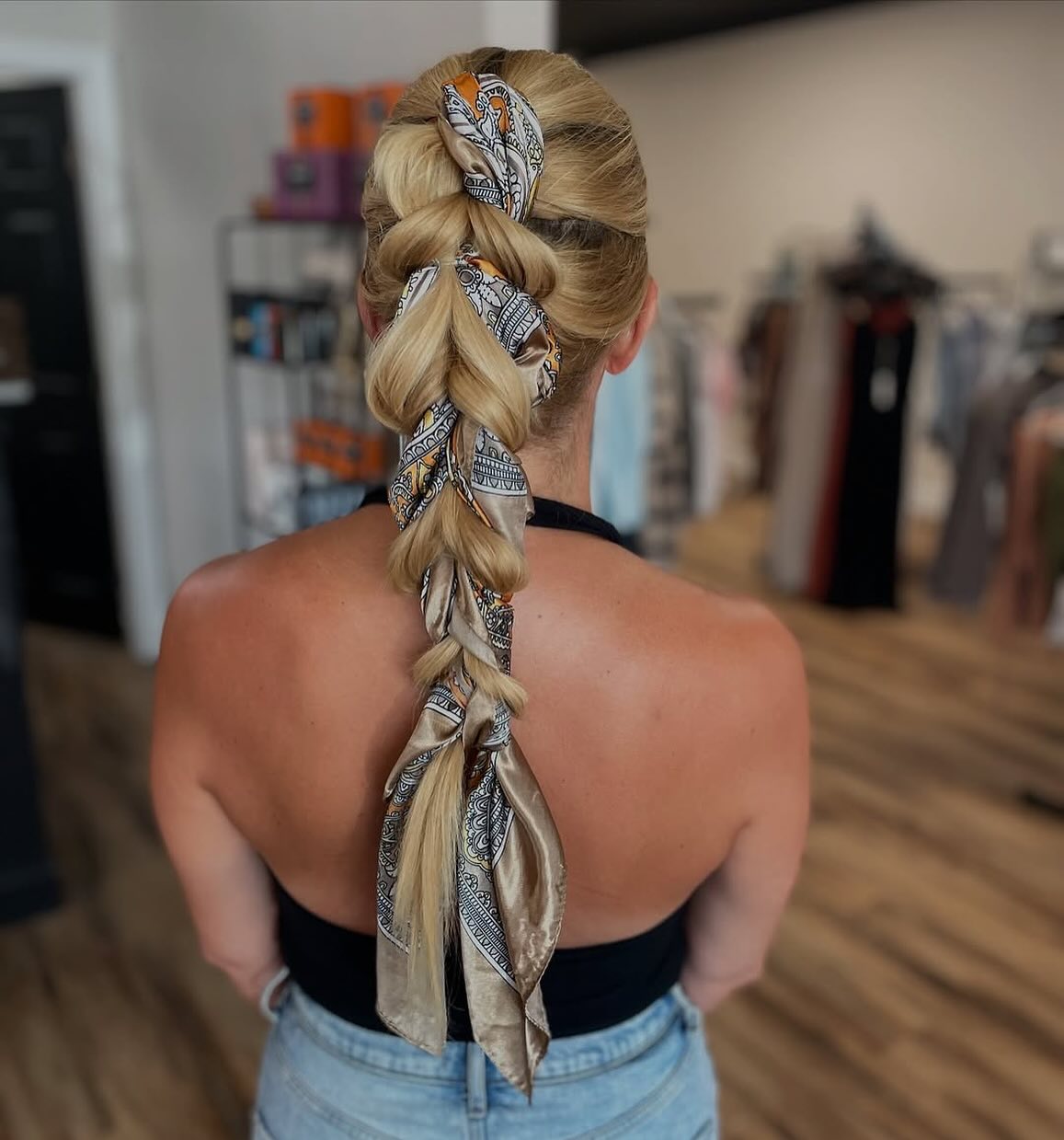 Chic Braided Ponytail with Decorative Scarf Accents