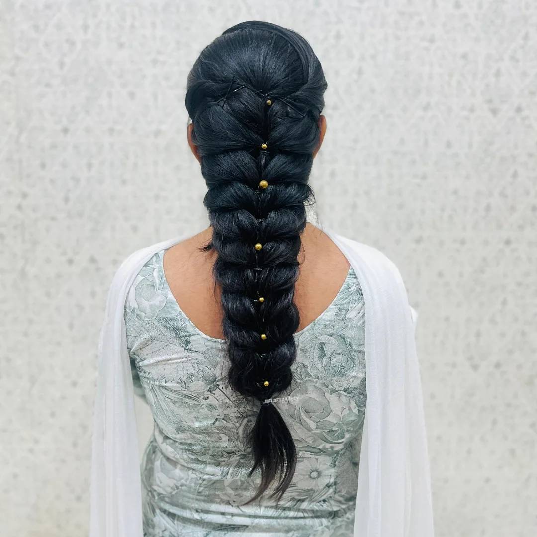 Elegant Long Braid with Gold Accents