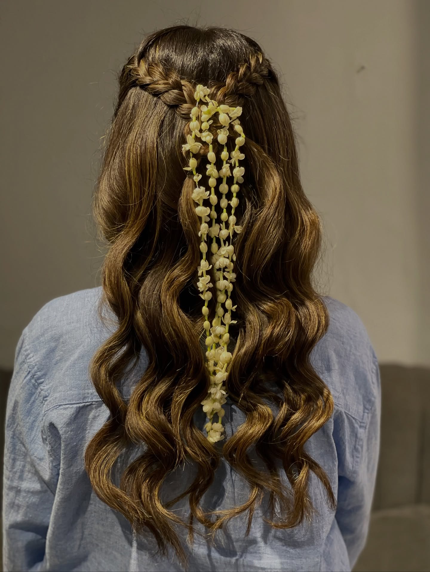 Romantic Half-Up Braided Hairstyle with Floral Accents