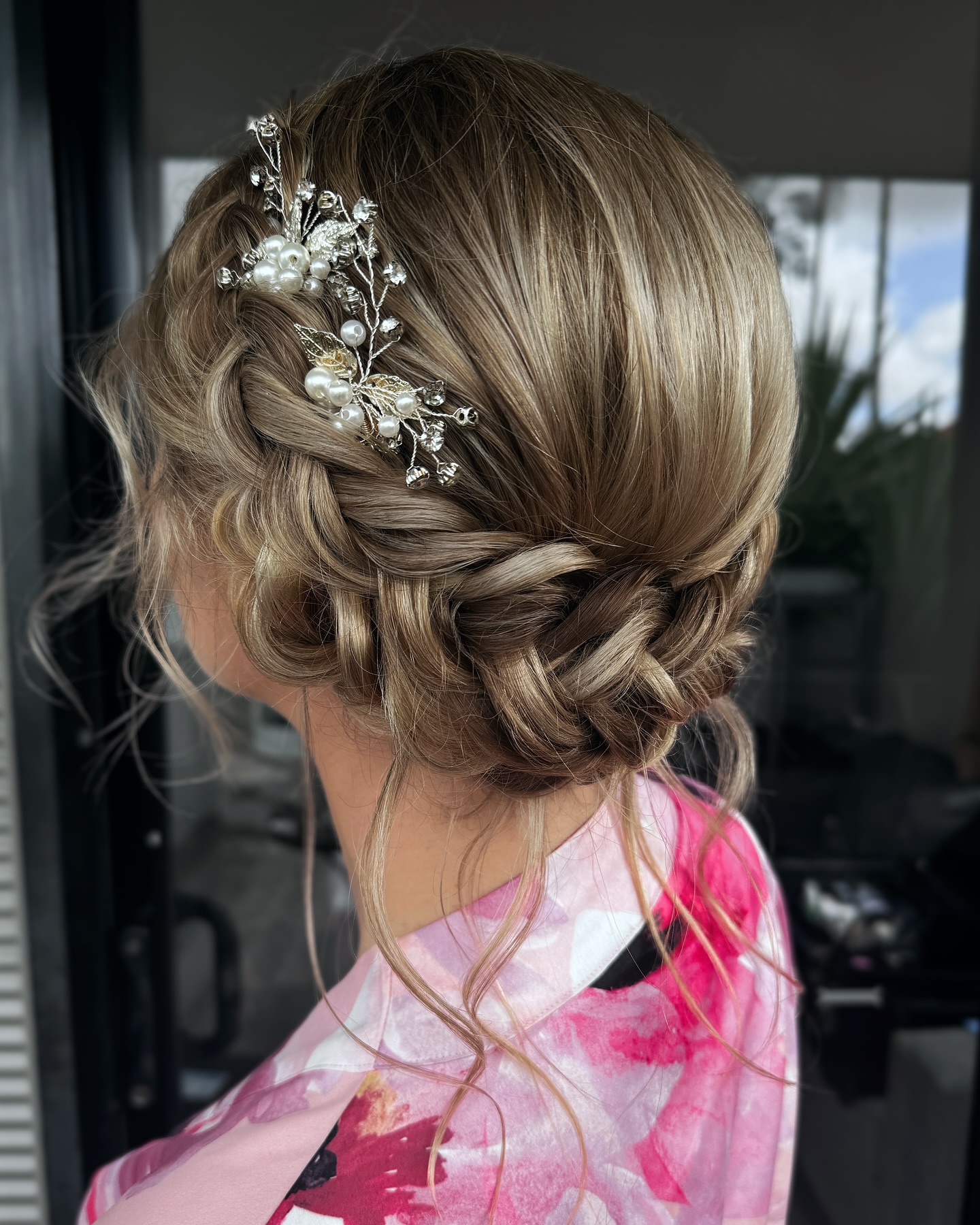 Romantic Textured Braided Updo with Floral Accents