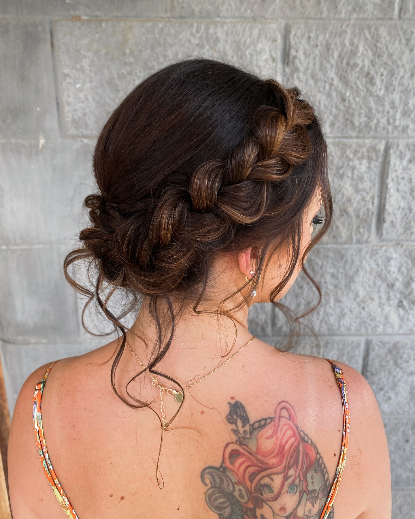 Textured Braided Low Bun with Romantic Loose Strands