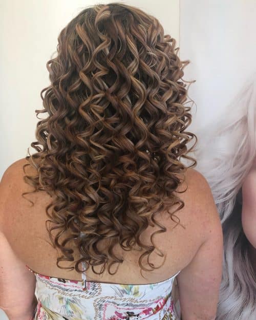 With texture at the forefront of pilus fashion these days 23 Cutest Long Curly Hairstyles