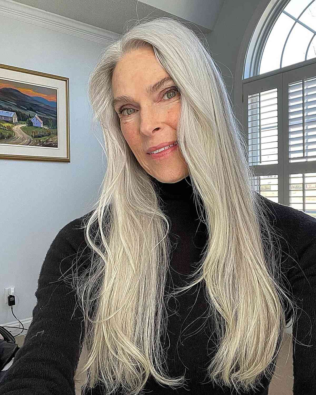 Grey Long Hair with Wispy Layers on Ladies Over 50