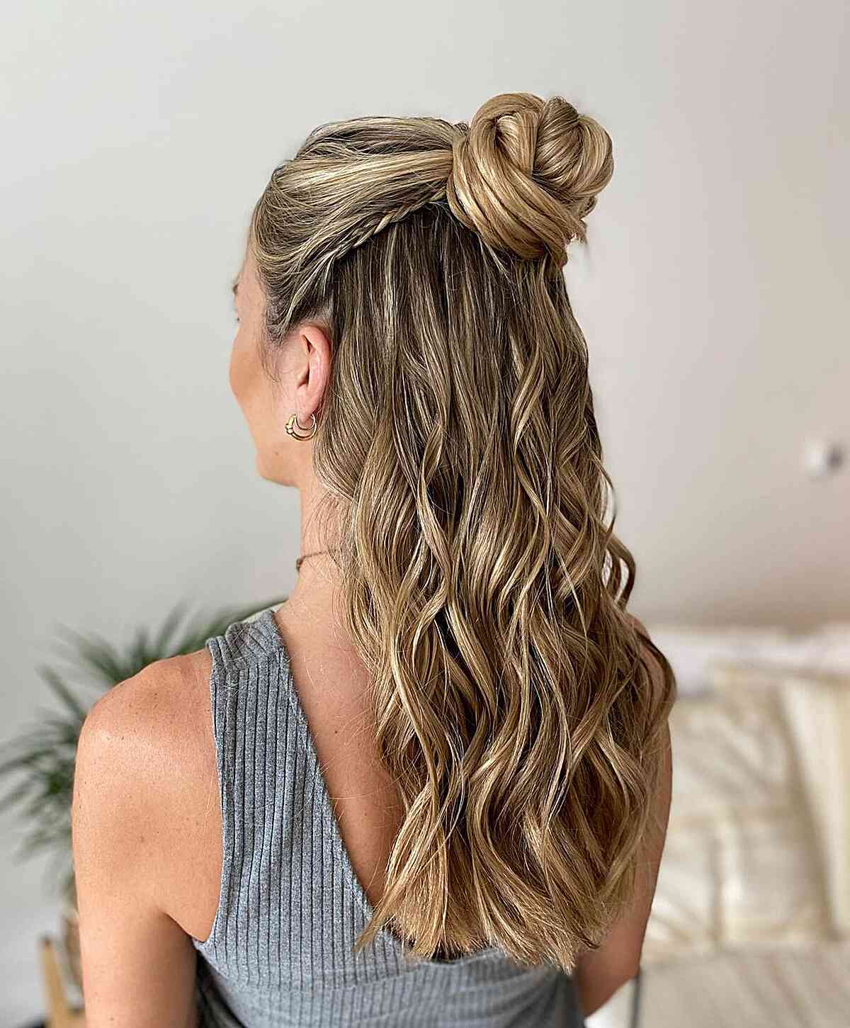 Long Half-Up Bun with Soft Waves for a Cowgirl
