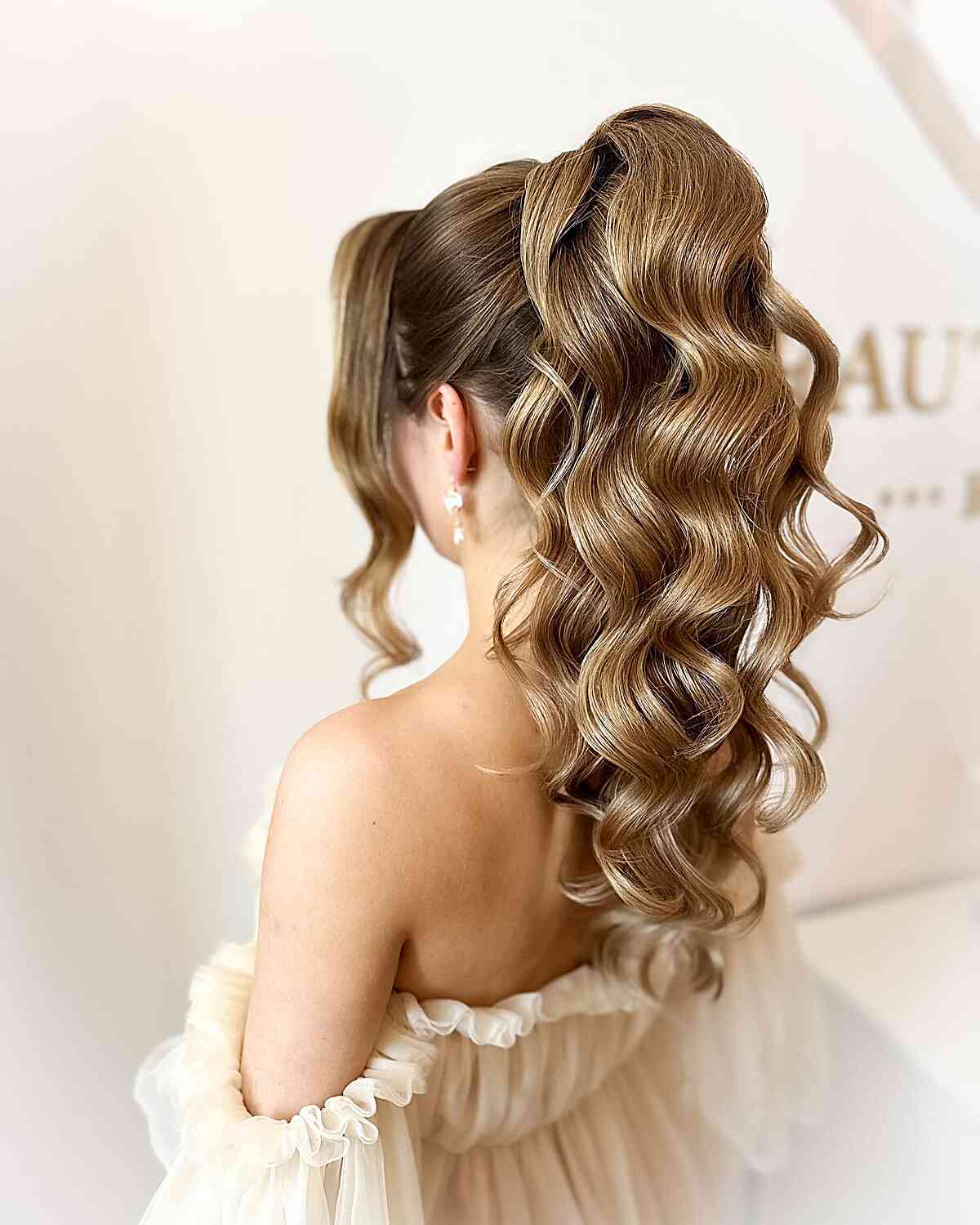 High Pony with Voluminous Curly Waves
