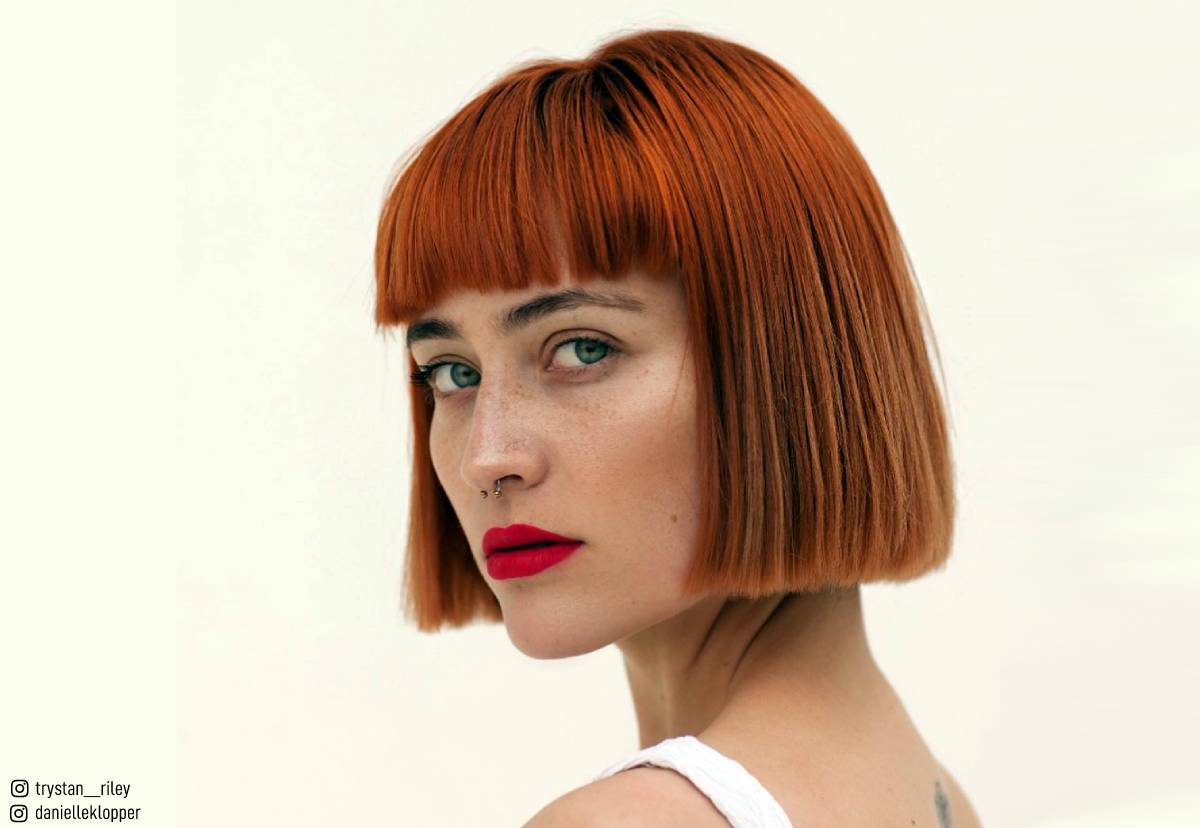 Image of Red blunt curly bob with fringe