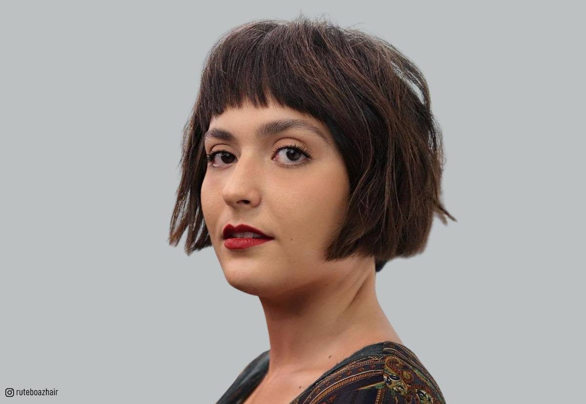 Image of Woman with short choppy blunt bob with blunt bangs