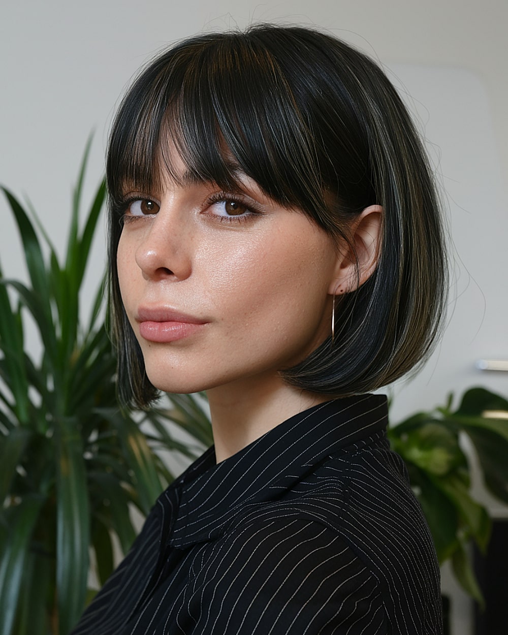 Rounded pinch bob with curtain bangs and natural volume for straight to wavy fine hair