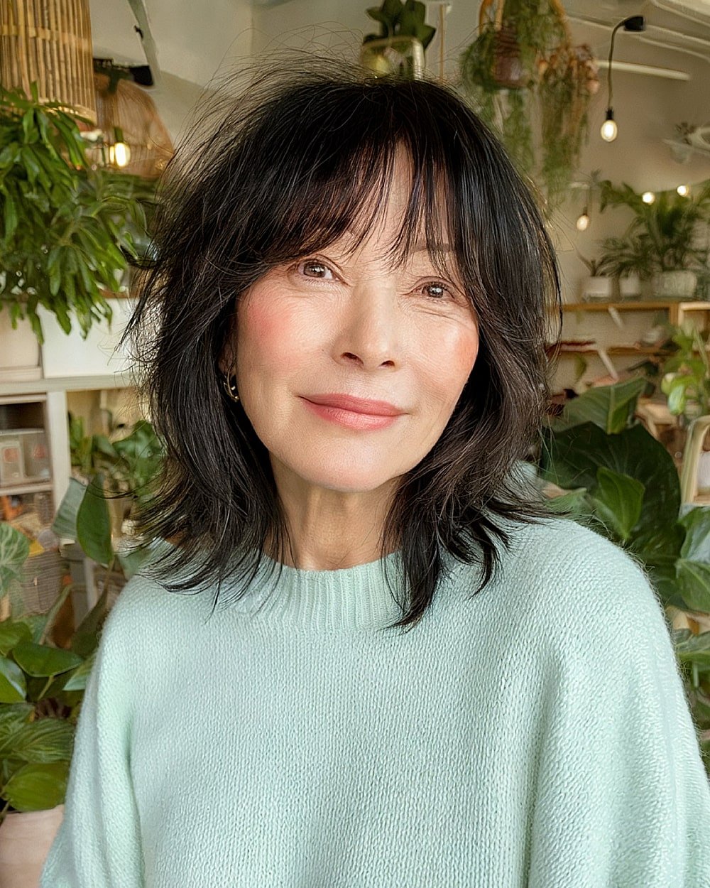 Korean-inspired shag haircut with wispy layers and soft fringe for playful women over 50