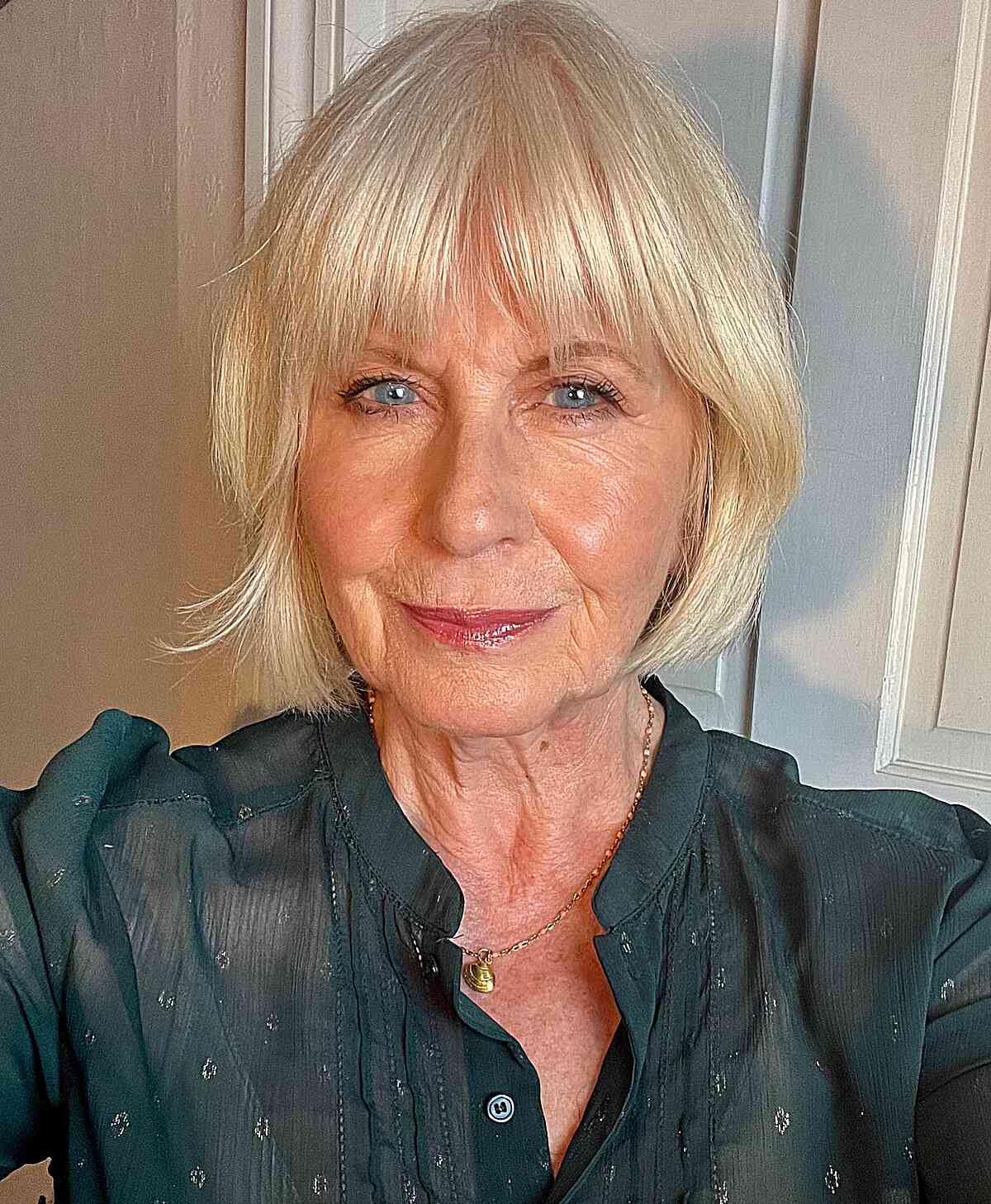 Layered Chin-Length Bob with Light Bangs for Grandmothers Over 50
