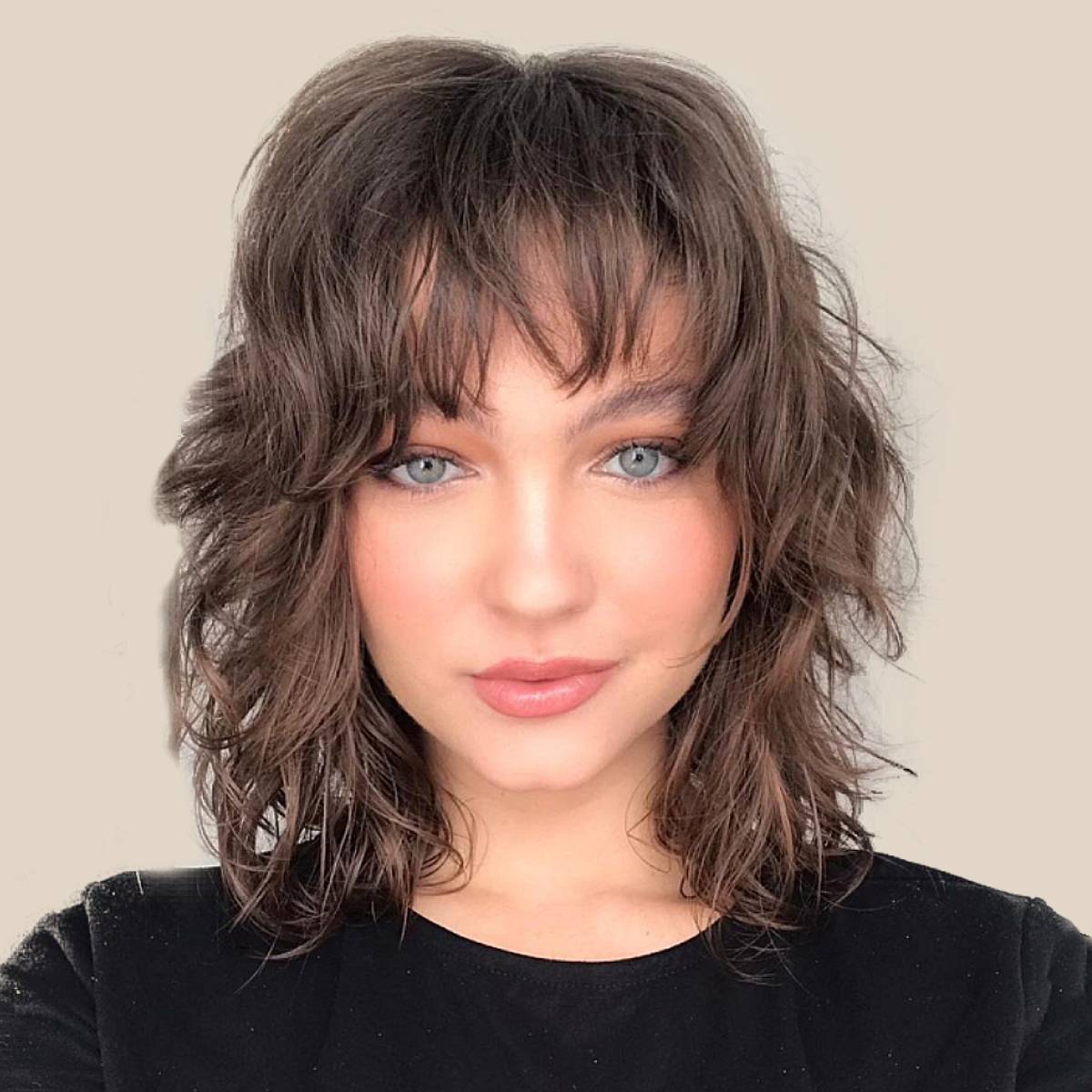 Image of Wavy hair with blunt bangs and short layers