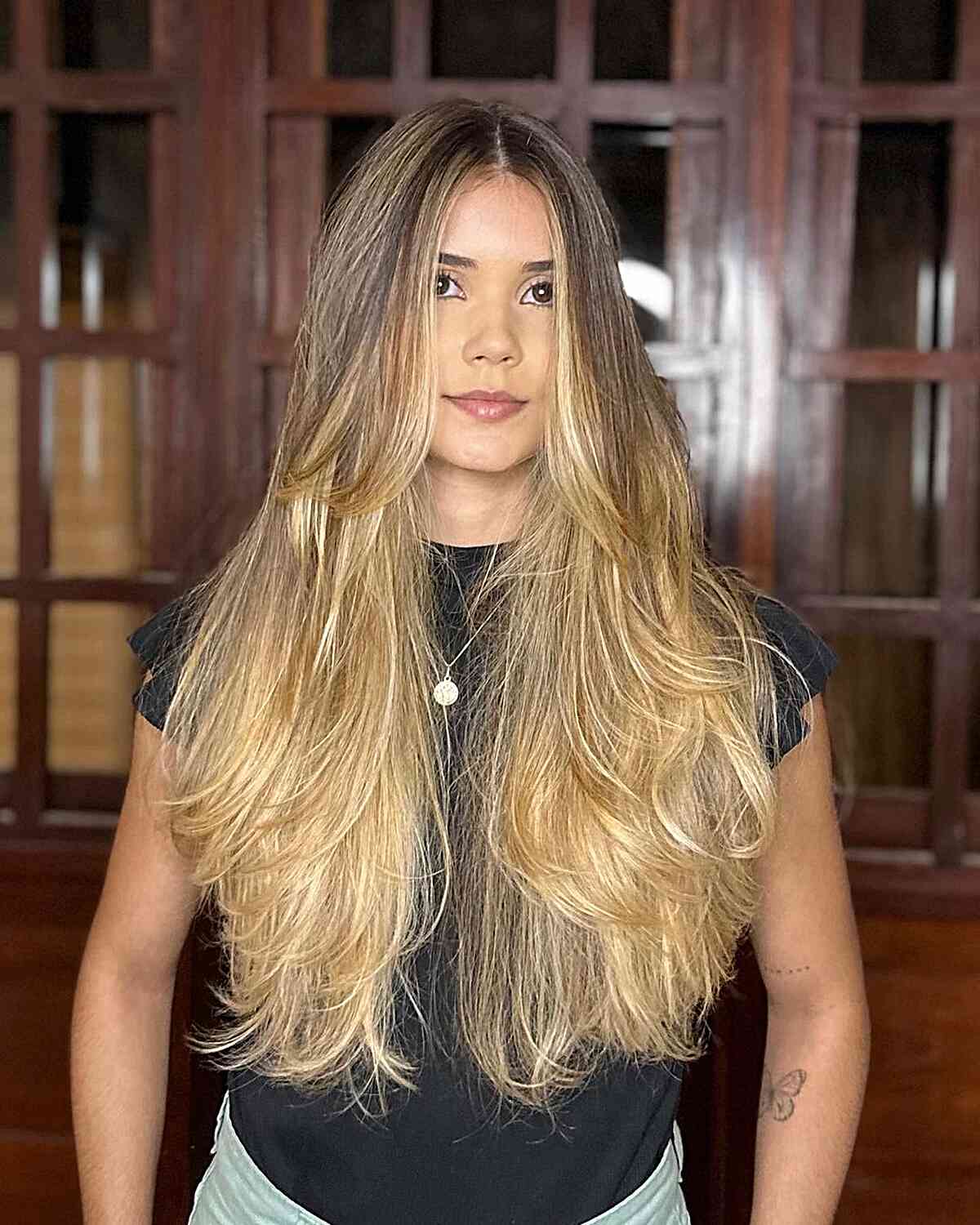 Long-Length Layered Mermaid Hair with Blonde Highlights