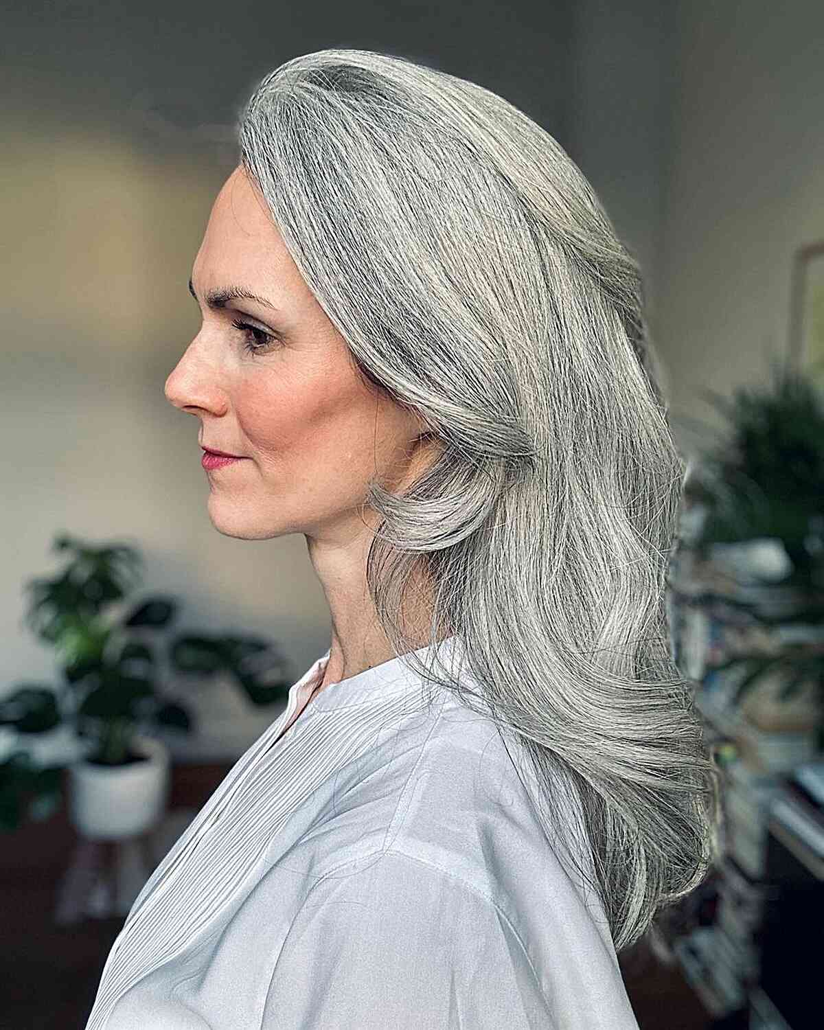 Mid-Long Layered Silver Grey Hair with Subtle Waves for 50-Year-Olds