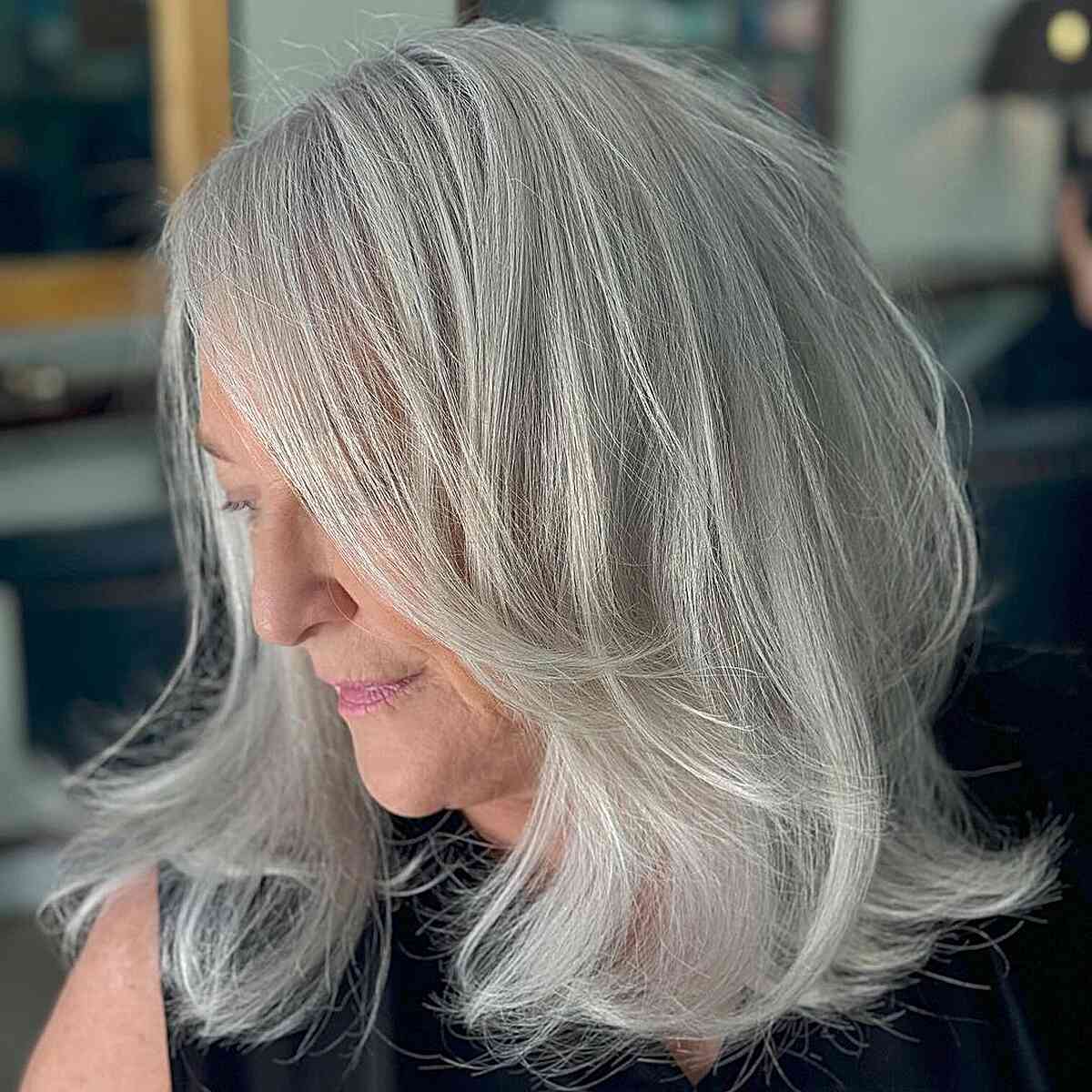 Light Ash Grey on Feathered Haircut for Older Ladies Aged Fifty