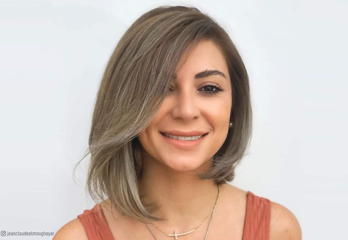 Image of Asymmetrical choppy lob hairstyle for long narrow face