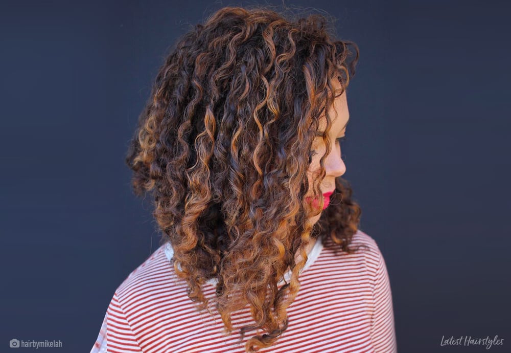 Image of Long asymmetrical blunt cut curly hair