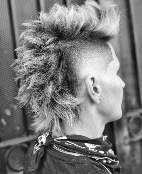 A imitation hawk fade is a type of fade that complements a imitation hawk hairstyle yesteryear adding contra xv Lit Faux Hawk Fade Haircuts for Guys